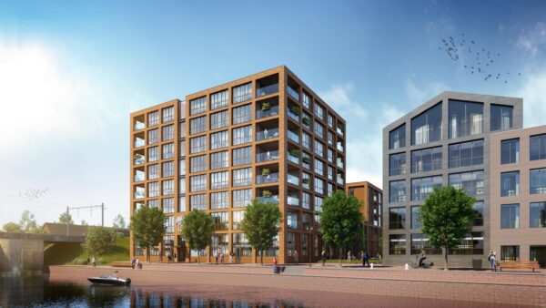 Artist impression van De Scheepmaker gezien vanaf het Spaarne, met de bakstenen gevel, balkons en de kade met bomen