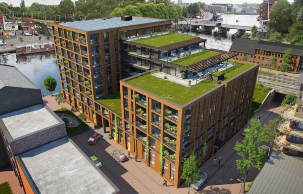 Artist impression van De Scheepmaker van bovenaf, met groene daken, dakterrassen op het getrapte middendeel en het Spaarne op de achtergrond