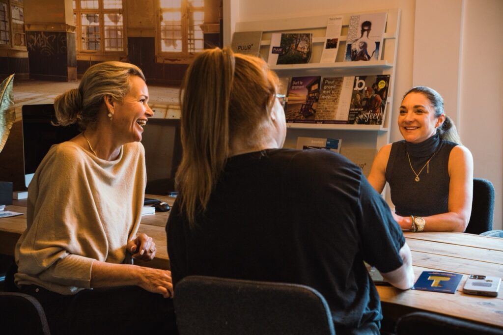 Three women having a meeting in an office.
