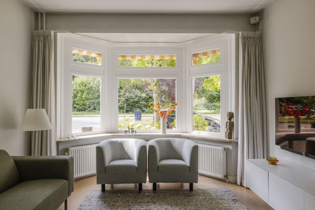 Modern living room with large bay windows