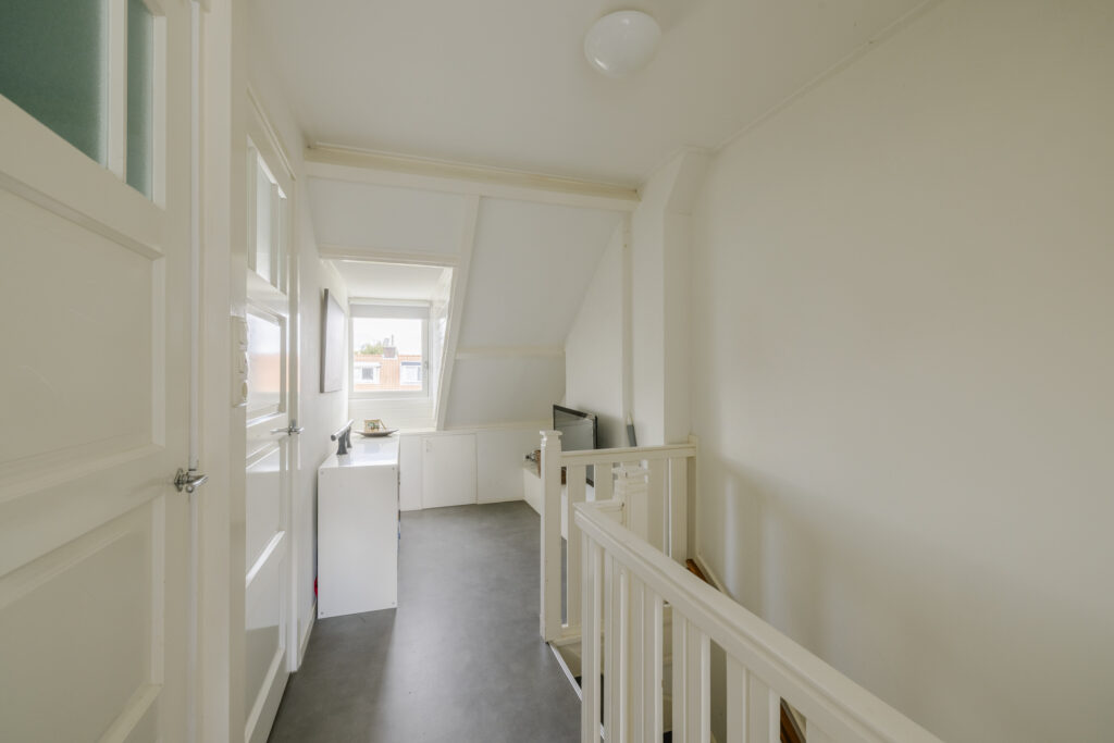 Bright upstairs hallway with window view