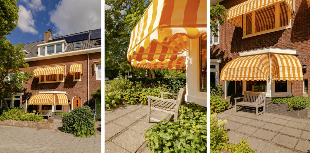 Brick house with yellow striped awnings