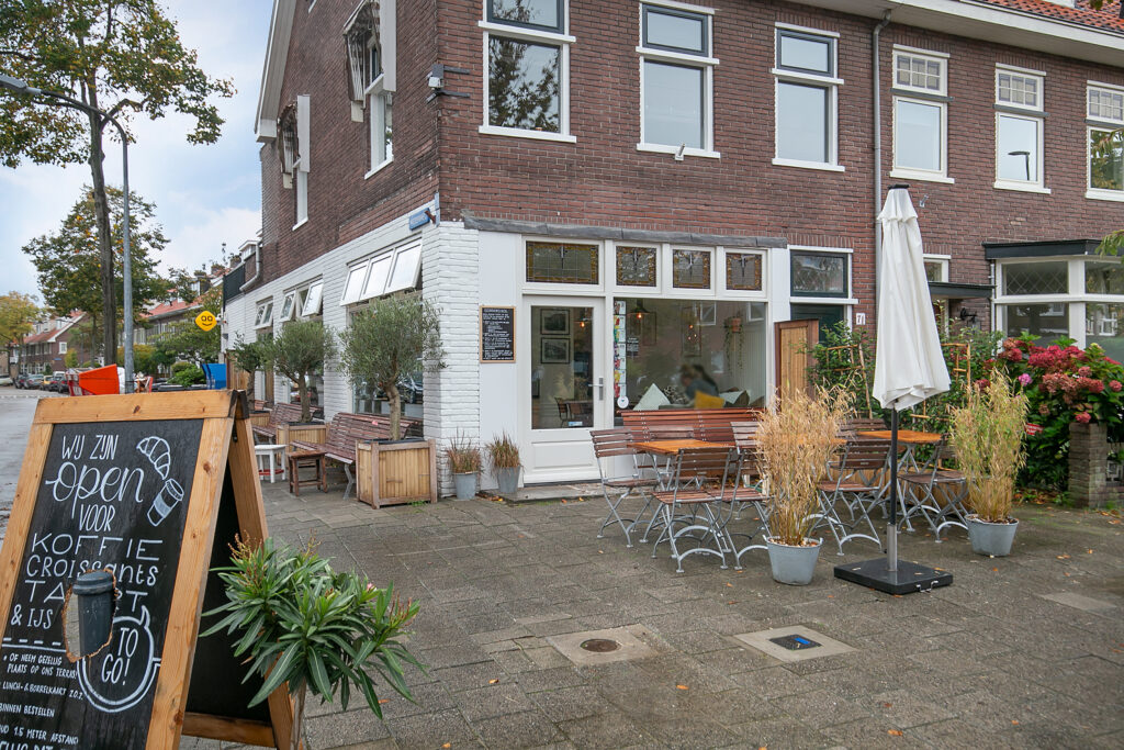 Charming café with outdoor seating in urban setting.