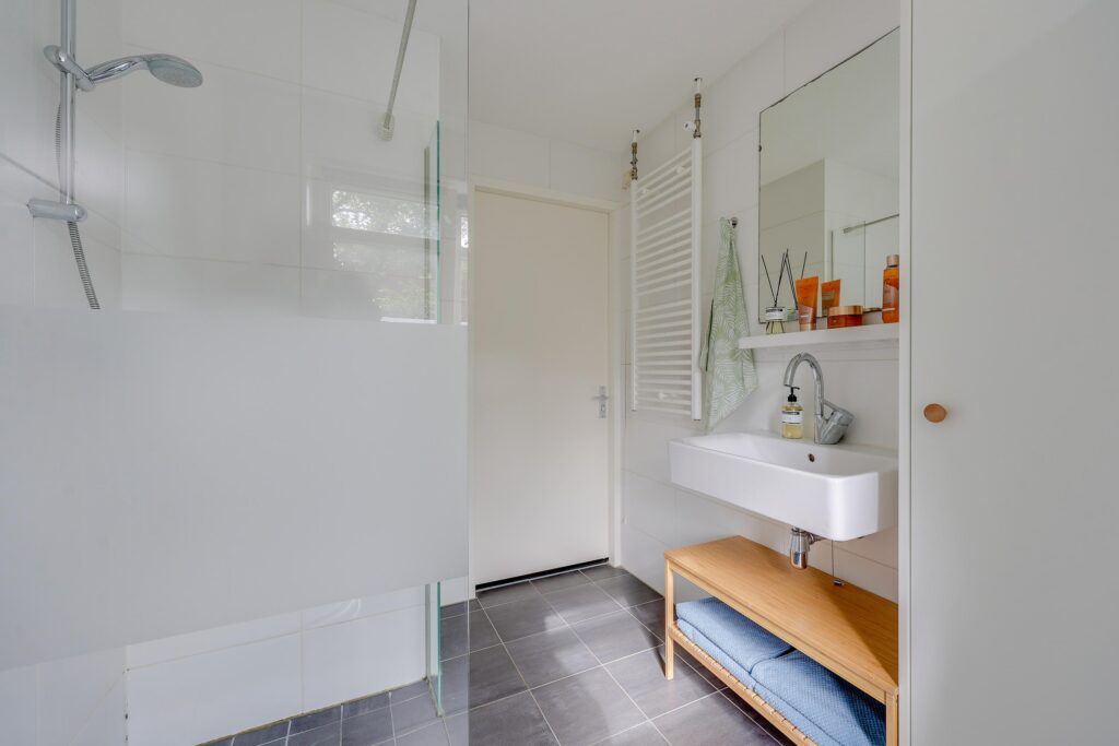 Modern bathroom with sink and shower area