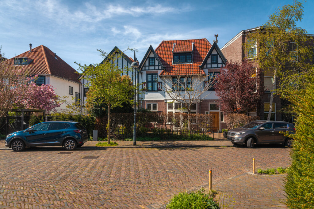 Charming houses with cars on a sunny street