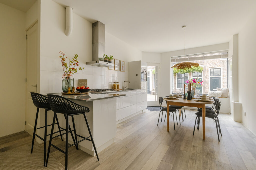 Modern kitchen and dining area with natural light.