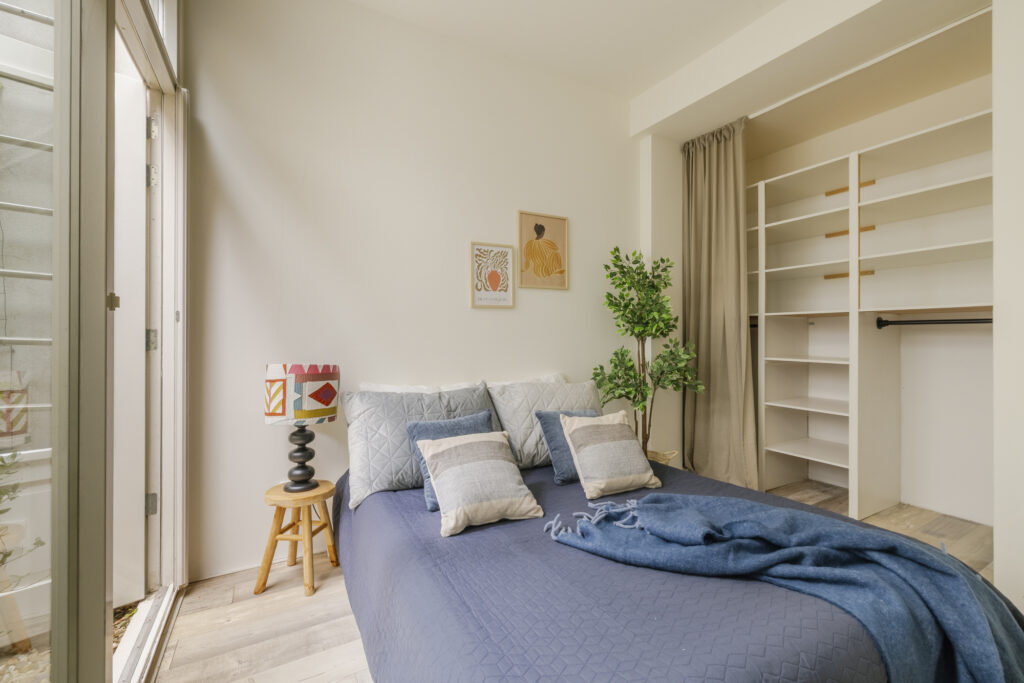 Cozy bedroom with modern decor and open closet