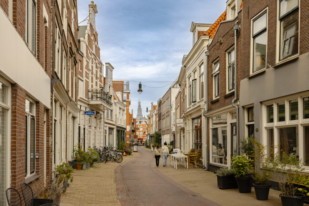Scenic European street with people walking.
