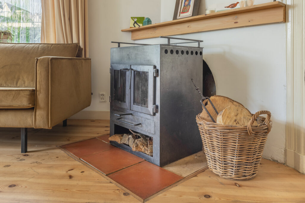Cozy living room with wood-burning stove and basket.