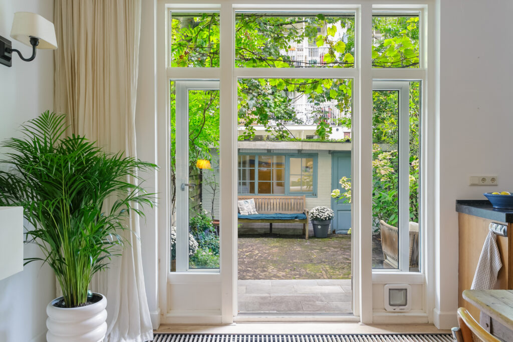 Cozy garden view through glass doors.