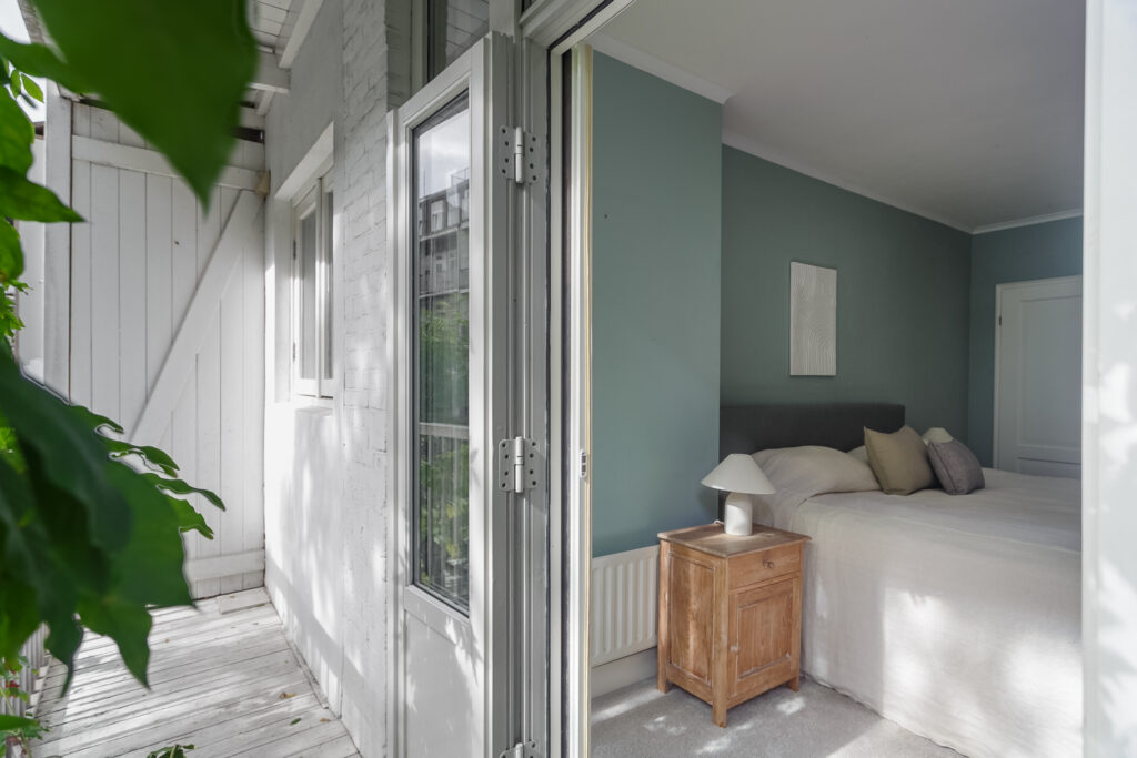 Cozy bedroom with outdoor view and natural light