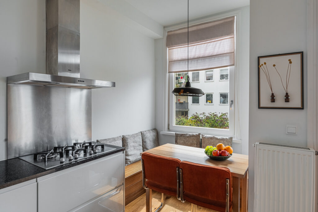Modern kitchen with dining area and large window