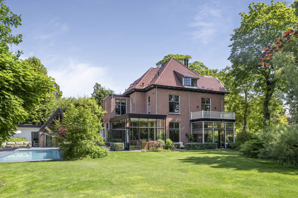 Brick house with large garden and pool
