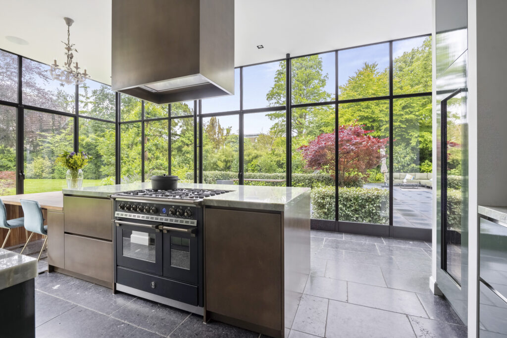 Modern kitchen with large garden-view windows