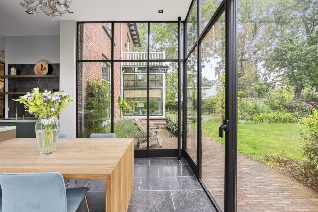 Modern dining area with garden view.