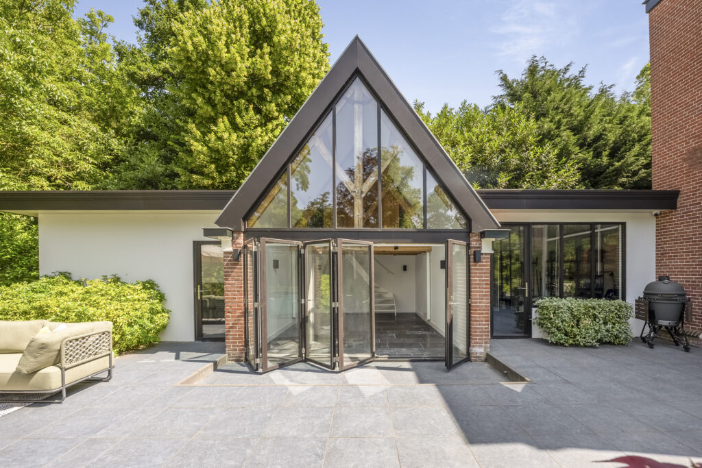 Modern house with large glass doors and patio