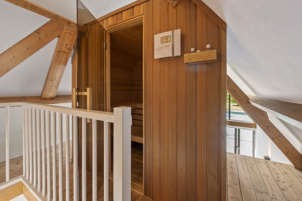 Modern attic sauna with wooden interior design.
