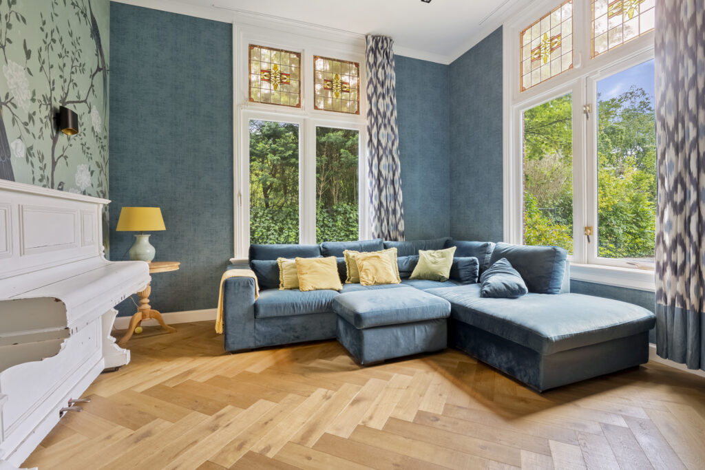 Cozy living room with blue sectional sofa