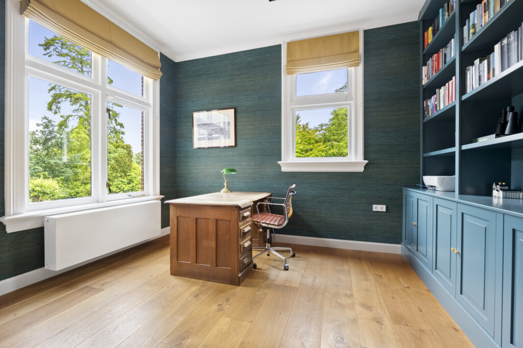 Home office with desk and bookshelf