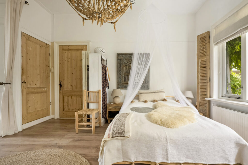 Cozy bedroom with rustic decor and canopy bed