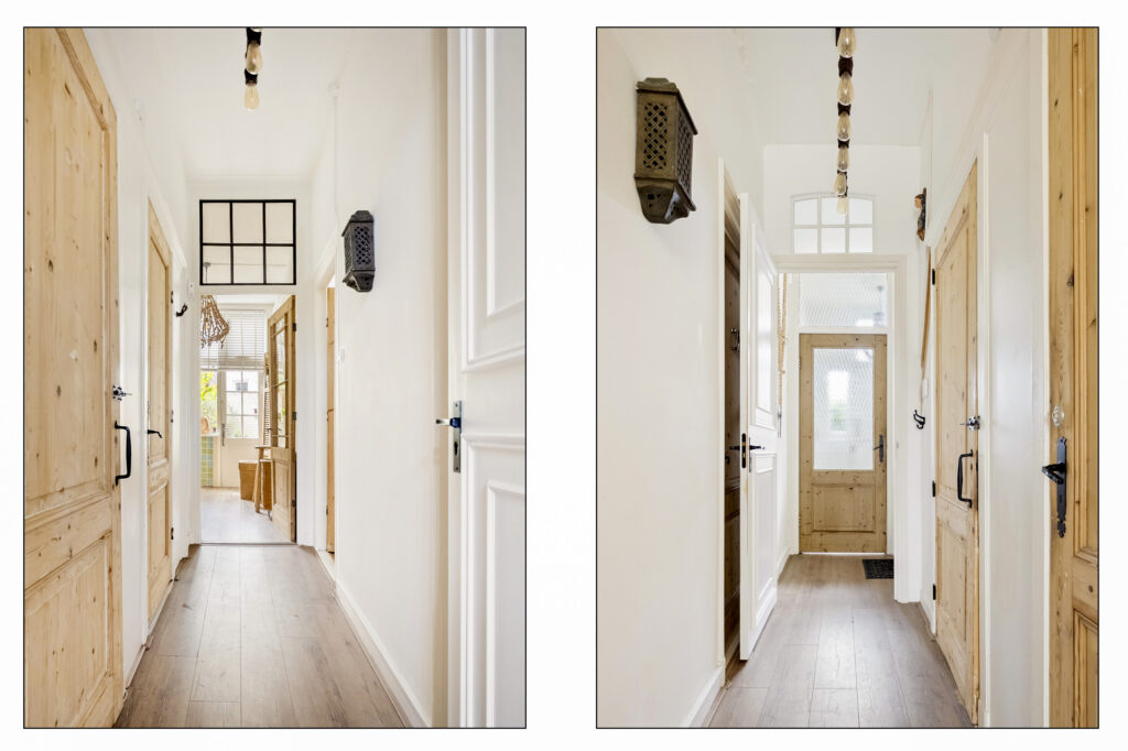 Bright hallway with wooden doors and white walls.