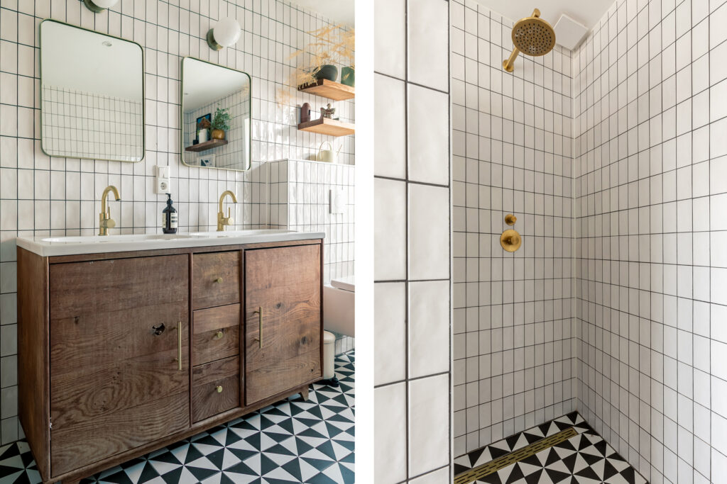 Modern bathroom with tiled shower and double vanity.