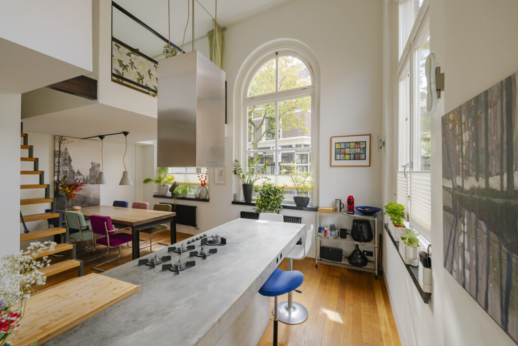 Modern kitchen and dining area with big windows