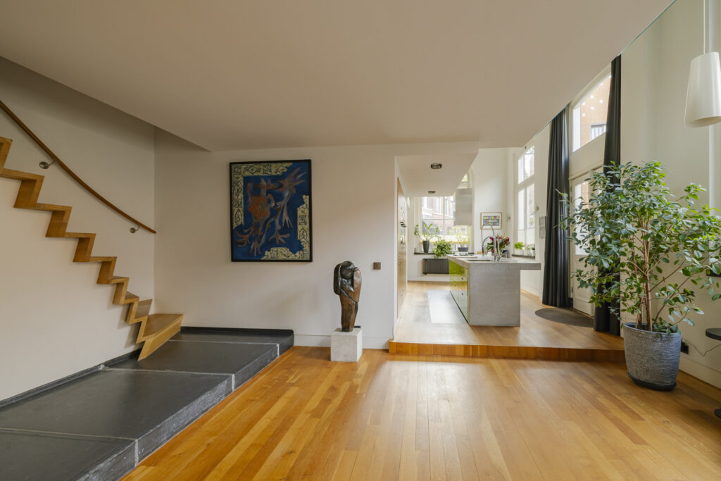 Modern home interior with artwork and kitchen