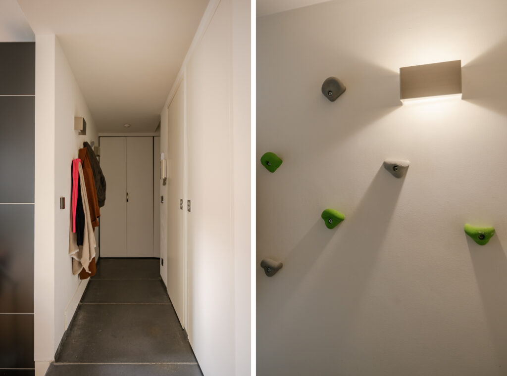 Hallway with coats and climbing wall detail