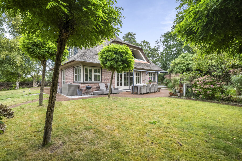 Charming cottage with garden and patio dining area.