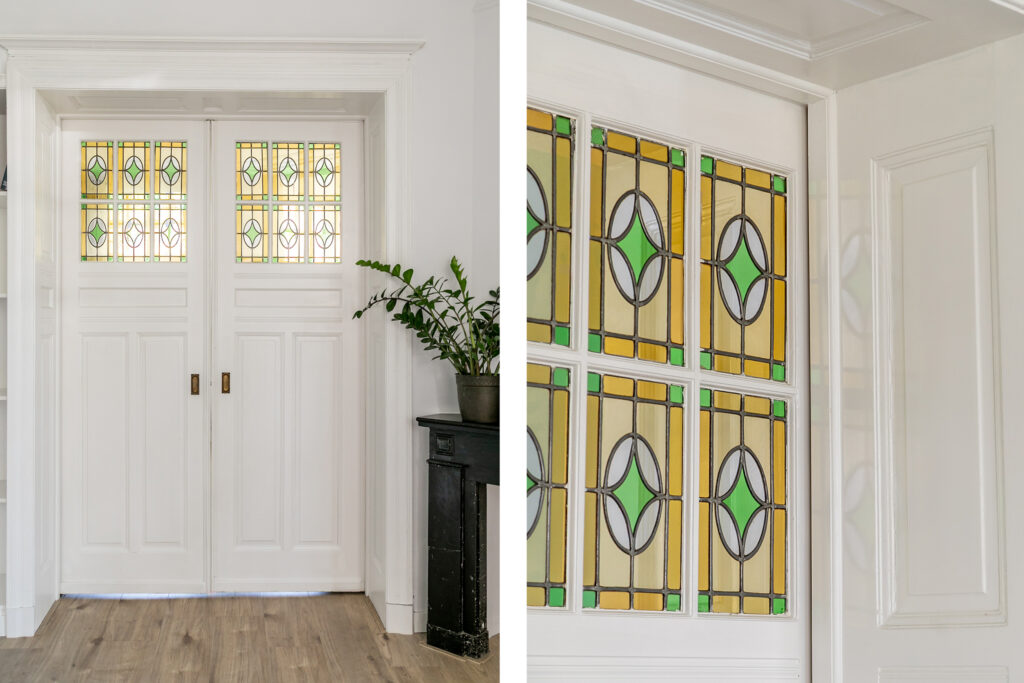 White doors with colorful stained glass panels.