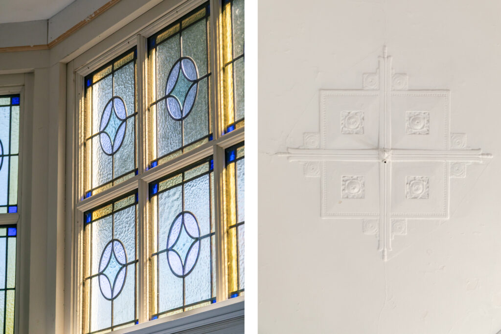 Decorative stained glass window and ceiling molding detail.