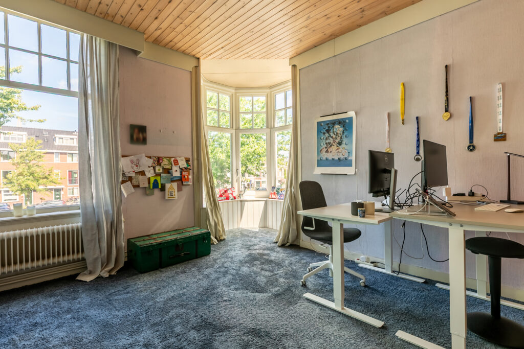 Bright home office with desk and computers