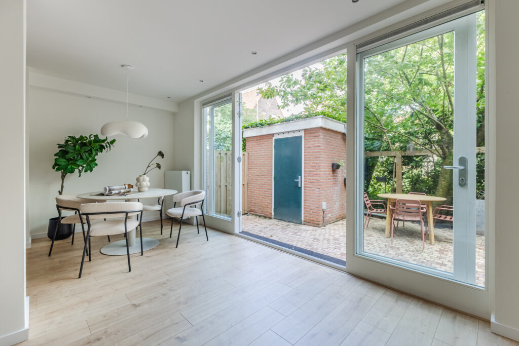 Modern dining room with garden view.