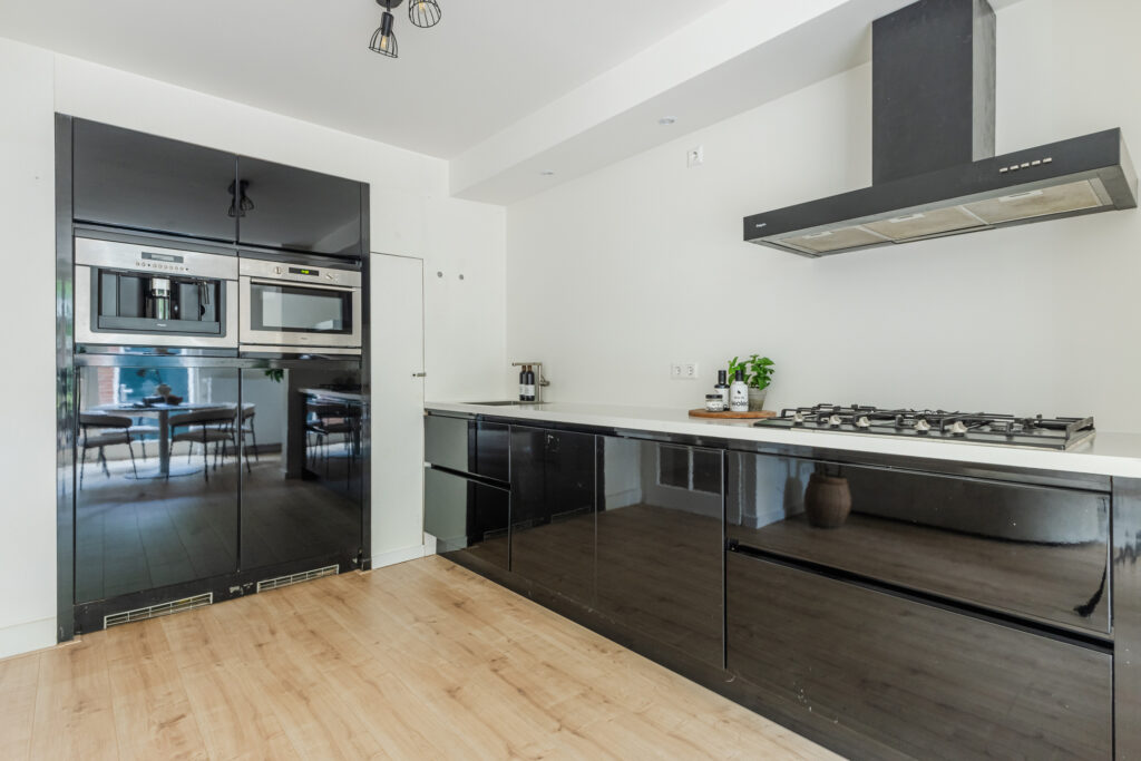 Modern kitchen with black cabinets and appliances