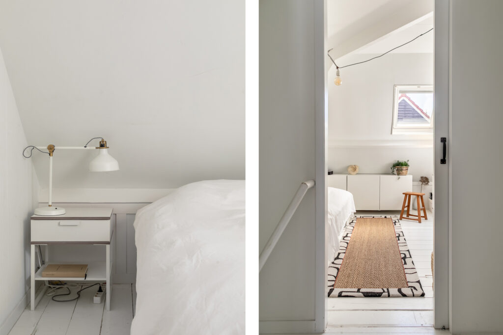 Minimalist white attic bedroom with natural light.