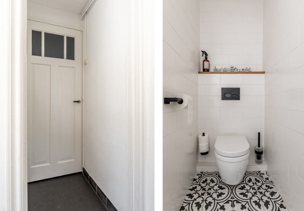 White bathroom with decorative floor tiles.