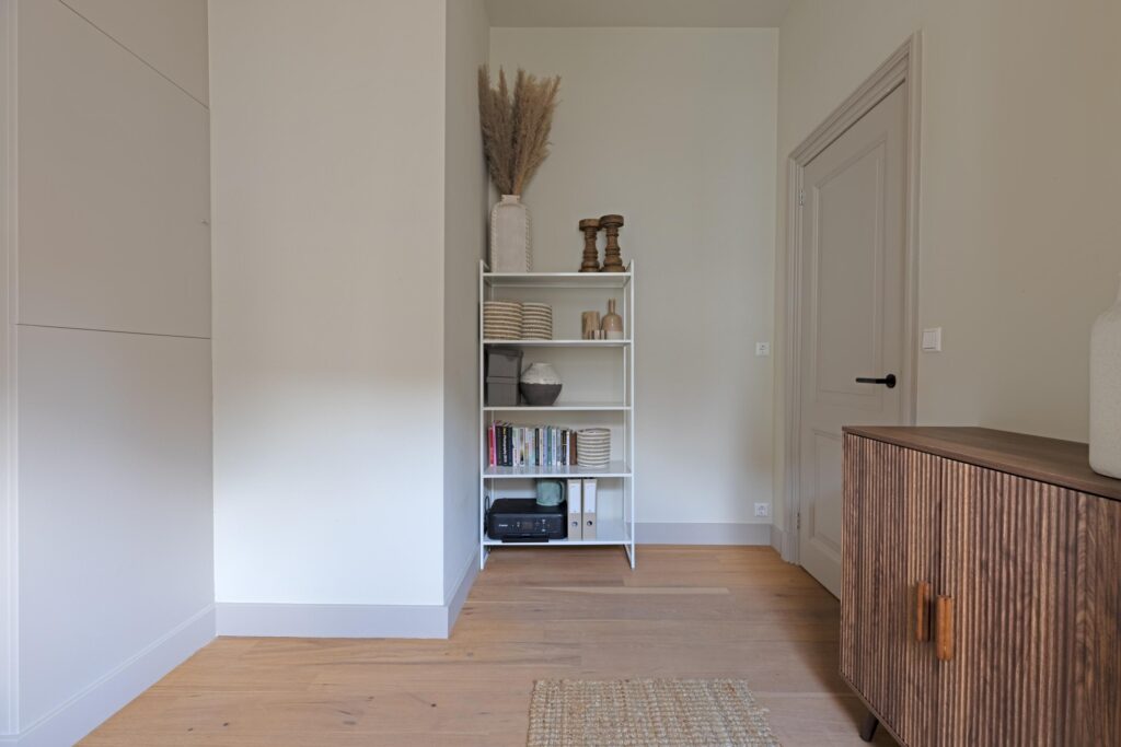 Minimalist room with wooden shelves and decor.