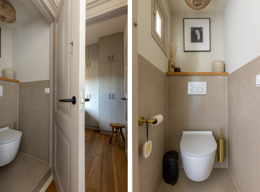 Modern bathroom with toilet and storage cabinets.