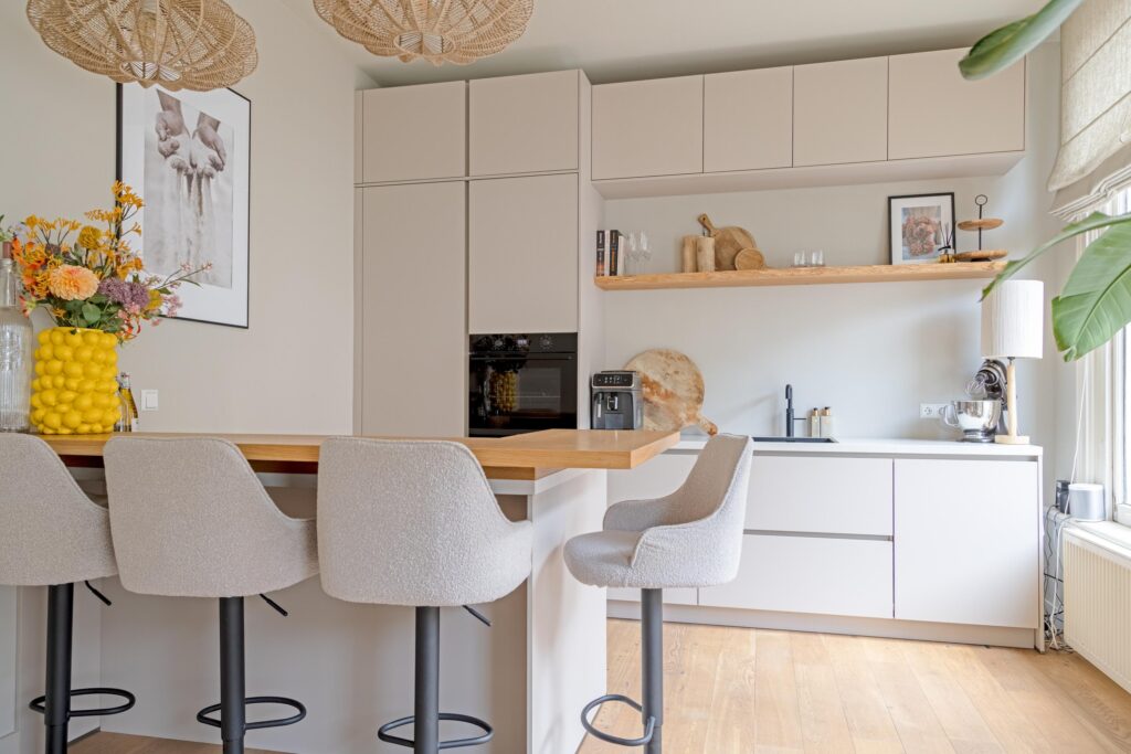 Modern kitchen with island and stools.