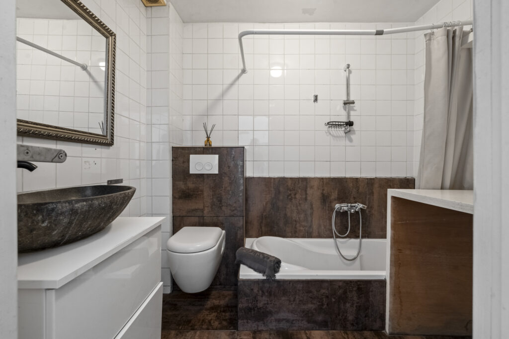 Modern bathroom with tub and vessel sink.