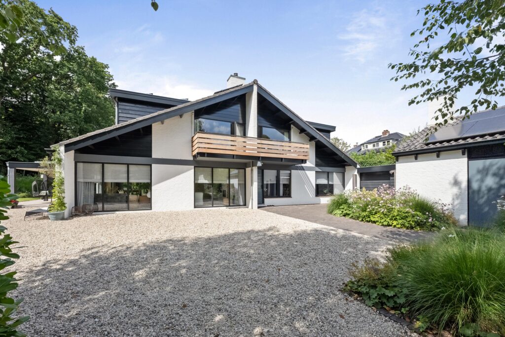 Modern house with a gravel pathway.