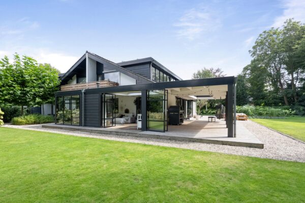 Modern house with spacious garden and patio.