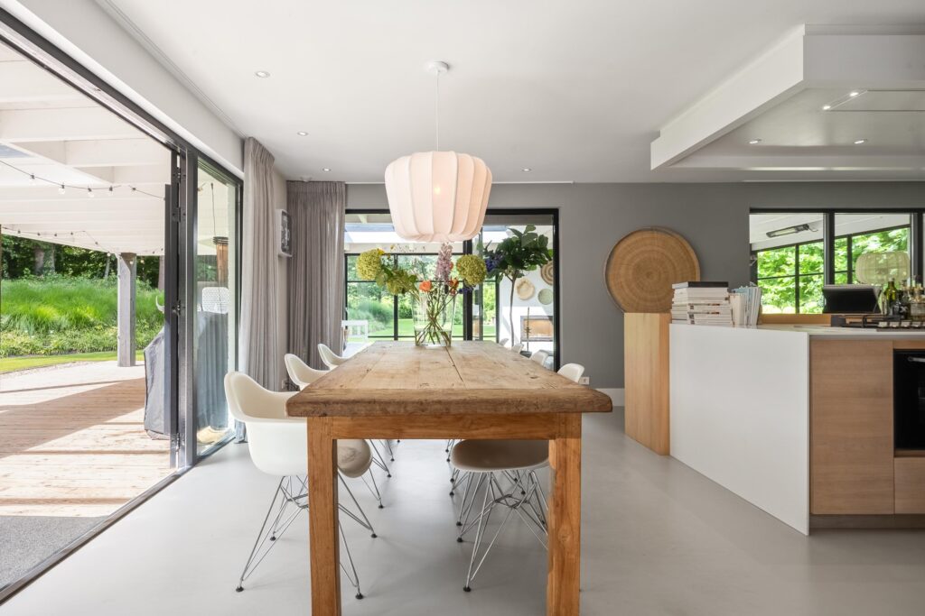 Modern dining area with wooden table and pendant light