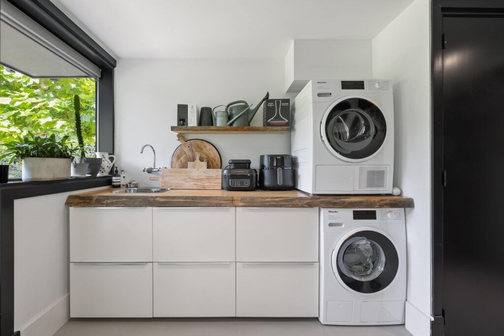 Modern laundry room with washer and dryer.