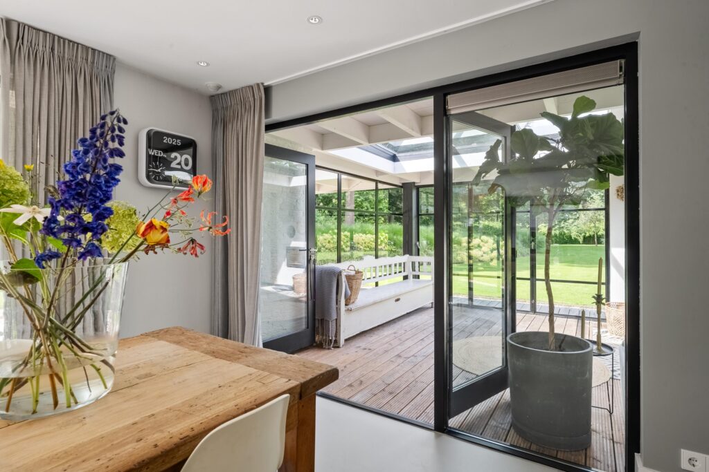 Modern dining room overlooking garden patio