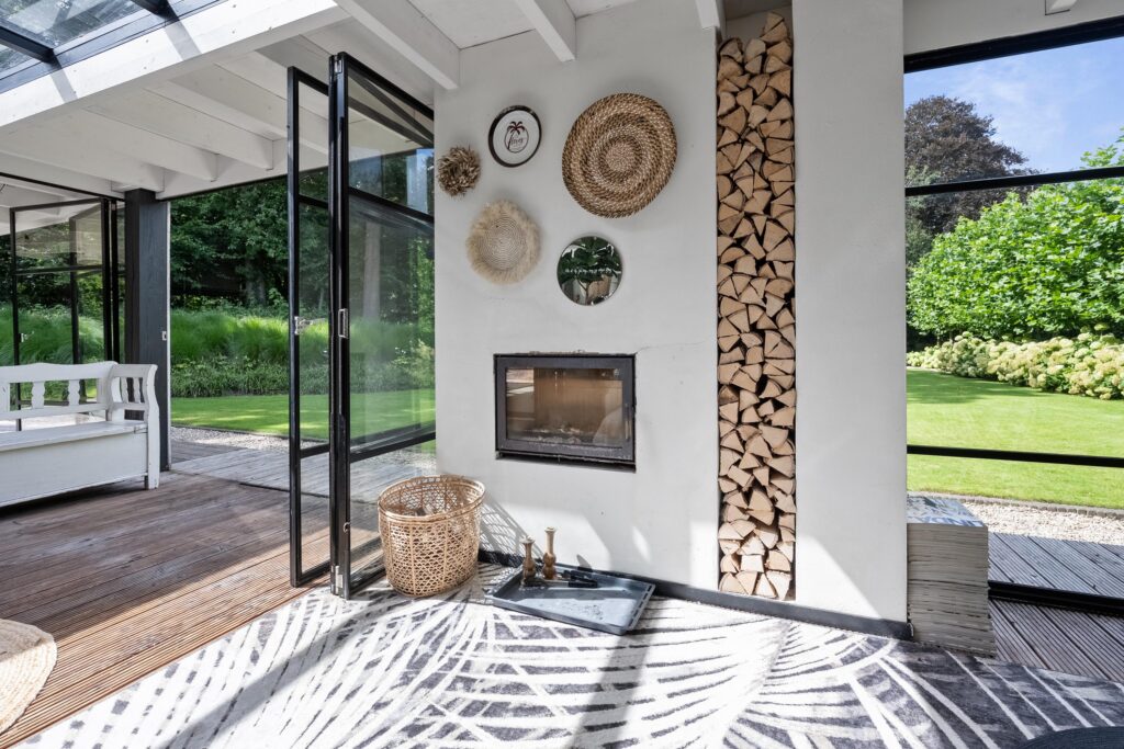 Modern sunroom with open doors to garden