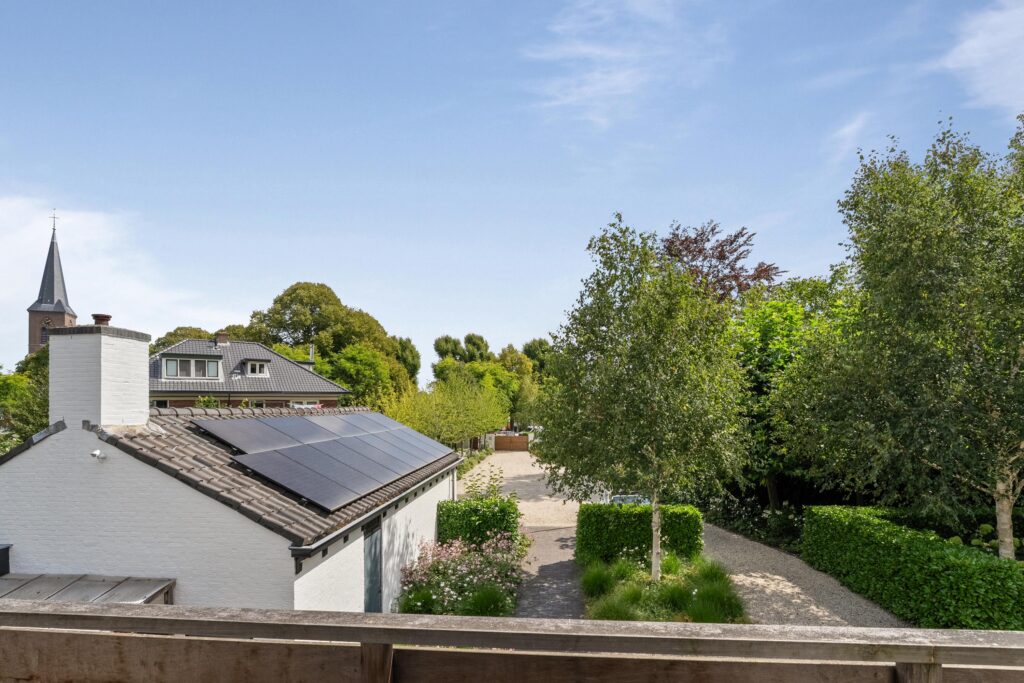 House with solar panels and garden