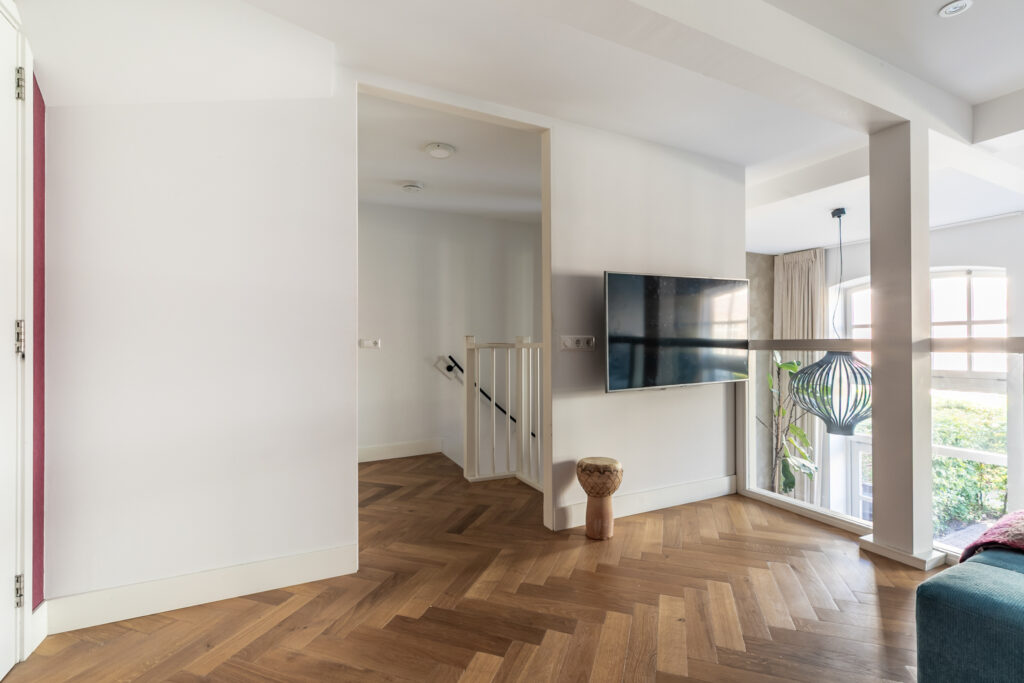 Modern living room with wooden floor and TV