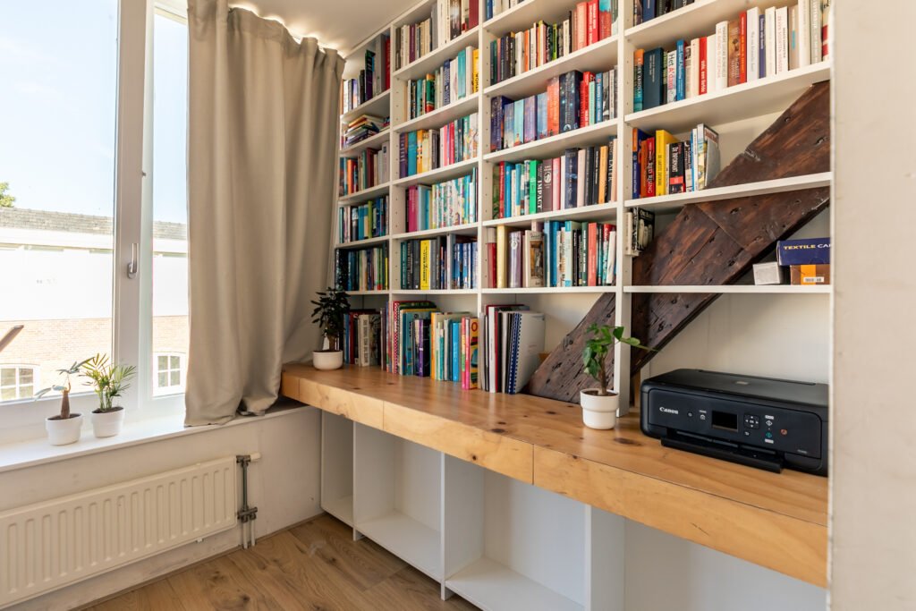 Cozy home library with books and printer.